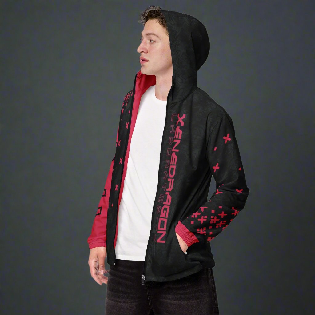 A model wearing the red and black hooded jacket showcasing the front of the design and the hood.