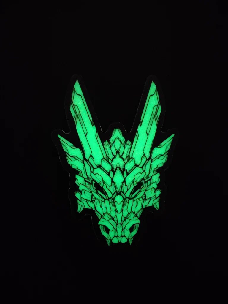A special glow in the dark material sticker in XeneDragon's Generation Three DRGN design, the dragon head show intricate black designs. This picture shows that the sticker has a bright green glow in a dark room.