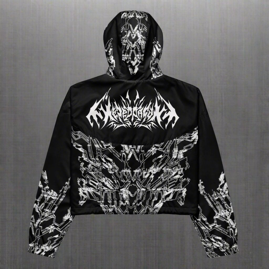 The back of a black cropped jacket with XeneDragon's white geometric pattern design and "XENEDRAGON" designed in metal band stylized font.