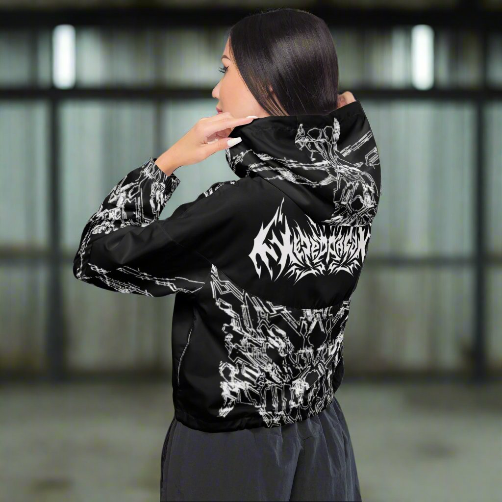 A model wearing a black cropped jacket with XeneDragon's white geometric pattern design.