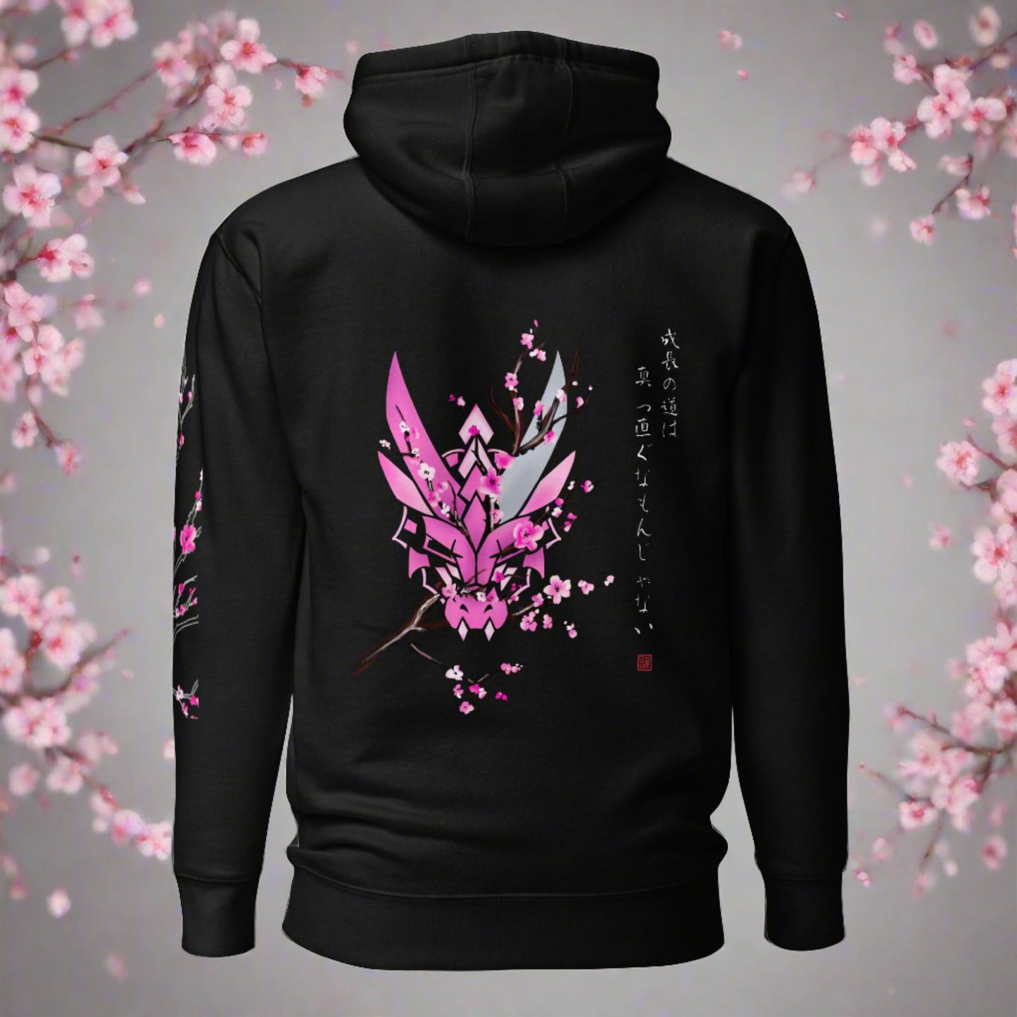 A black hoodie with a graphic design on the back. The design features a stylized dragon head with cherry blossoms surrounding it. Japanese text on the hoodie is translated to "Growth is non-linear"