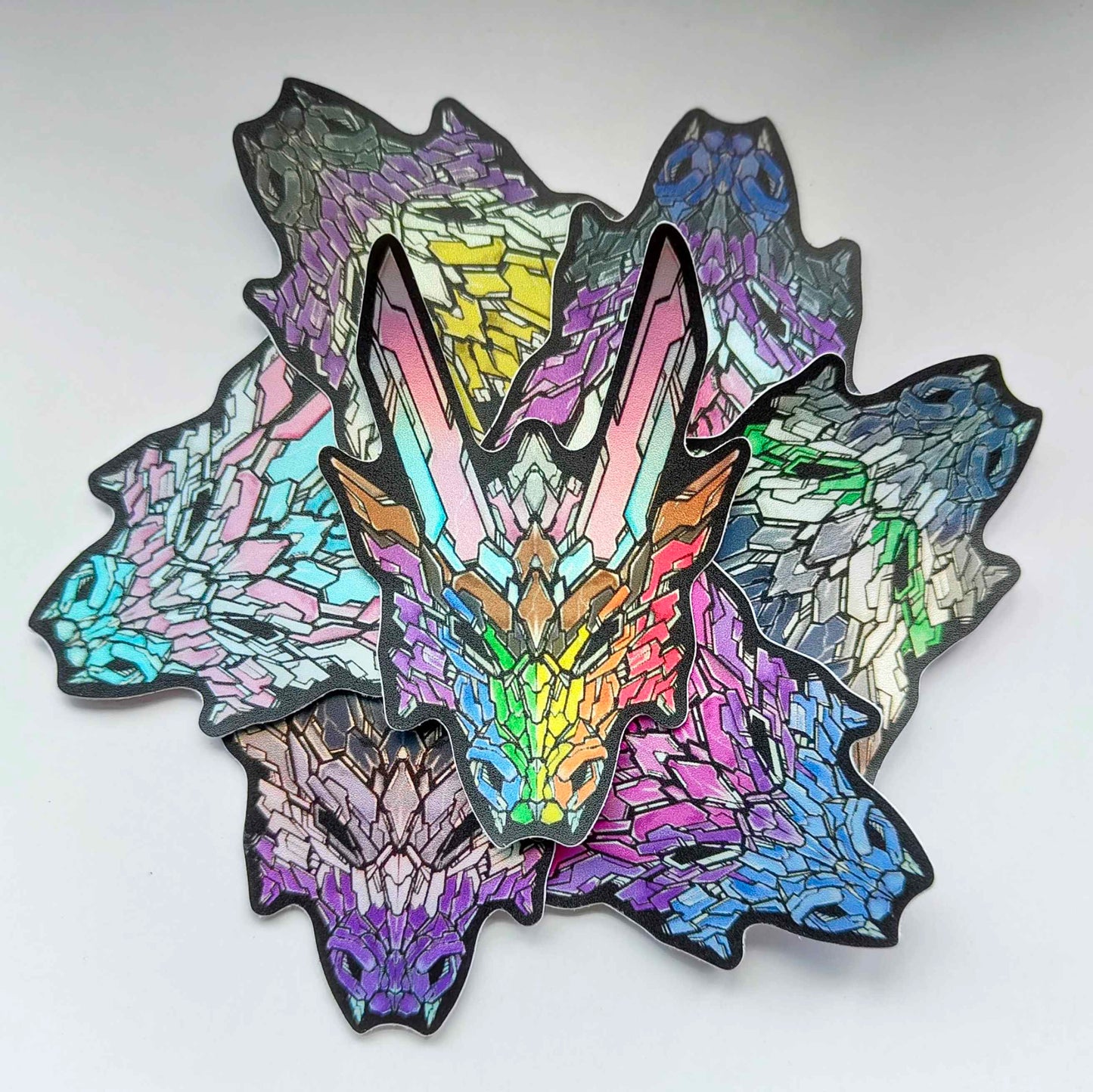 A collection of all 7 different pride G3 DRGN stickers.
