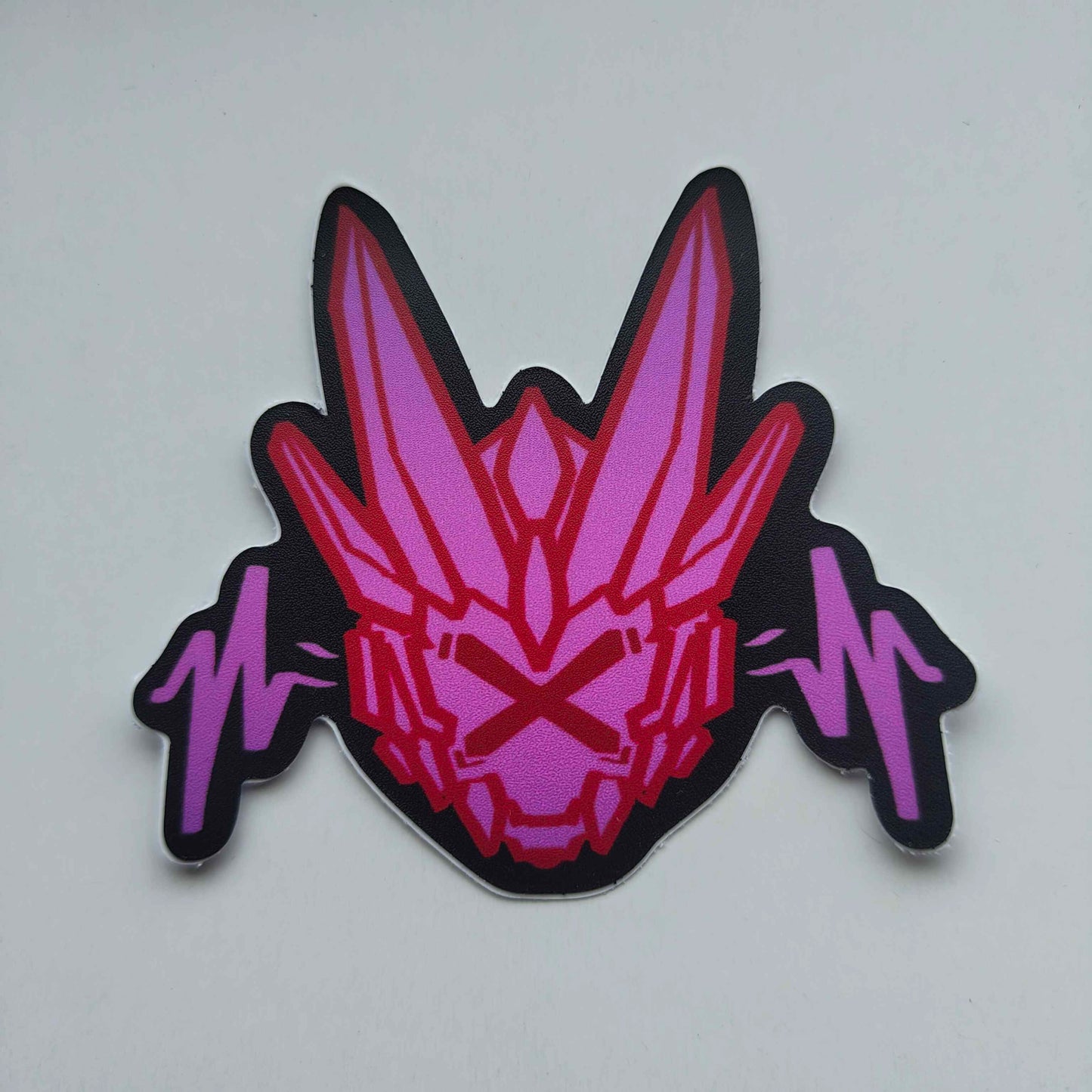 A sticker with a detailed design of a stylized dragon's head. The design features a dark background with a bright pink, geometric shapes and two pink, wavy lines below.