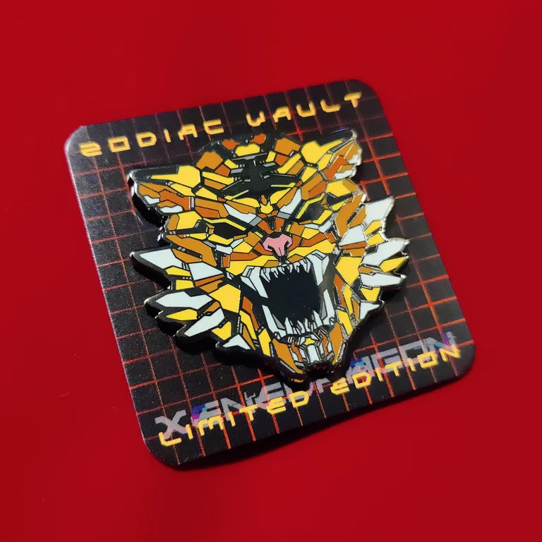 A limited edition enamel pin with vibrant geometric design celebrating the Year of the Tiger. The pin features a stylized image of a tiger's head in gold and yellow color scheme. The backing paper for the pin says "ZODIAC VAULT LIMITED EDITION"