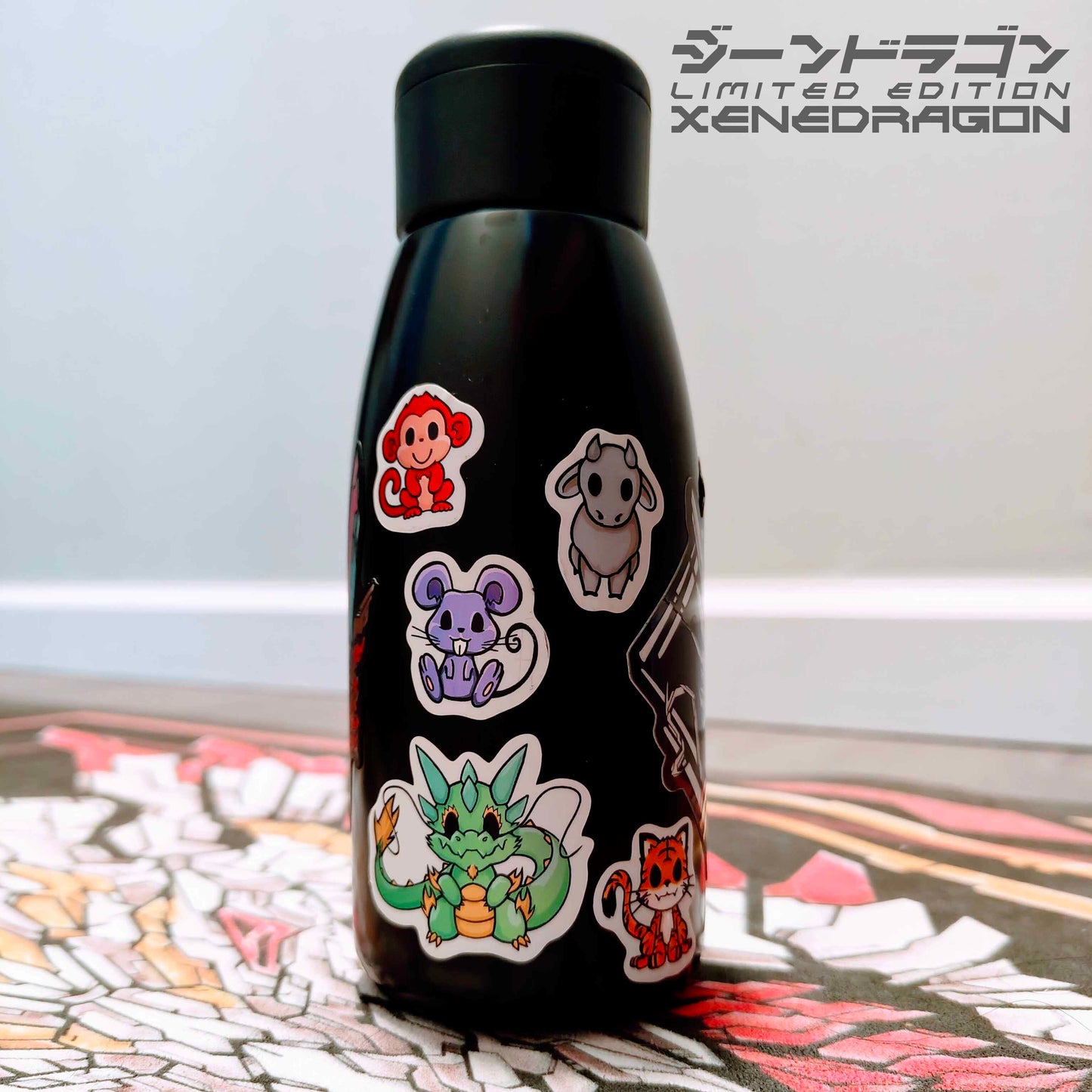 A water bottle displaying stickers of Xenon the Dragon and his Zodiac Friends.