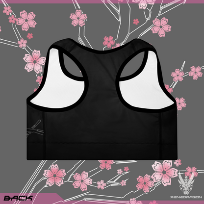 The back of a black sports bra with pink accents and geometric Japanese cherry blossom pattern design.