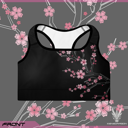 A black sports bra with pink accents and geometric Japanese cherry blossom pattern design.