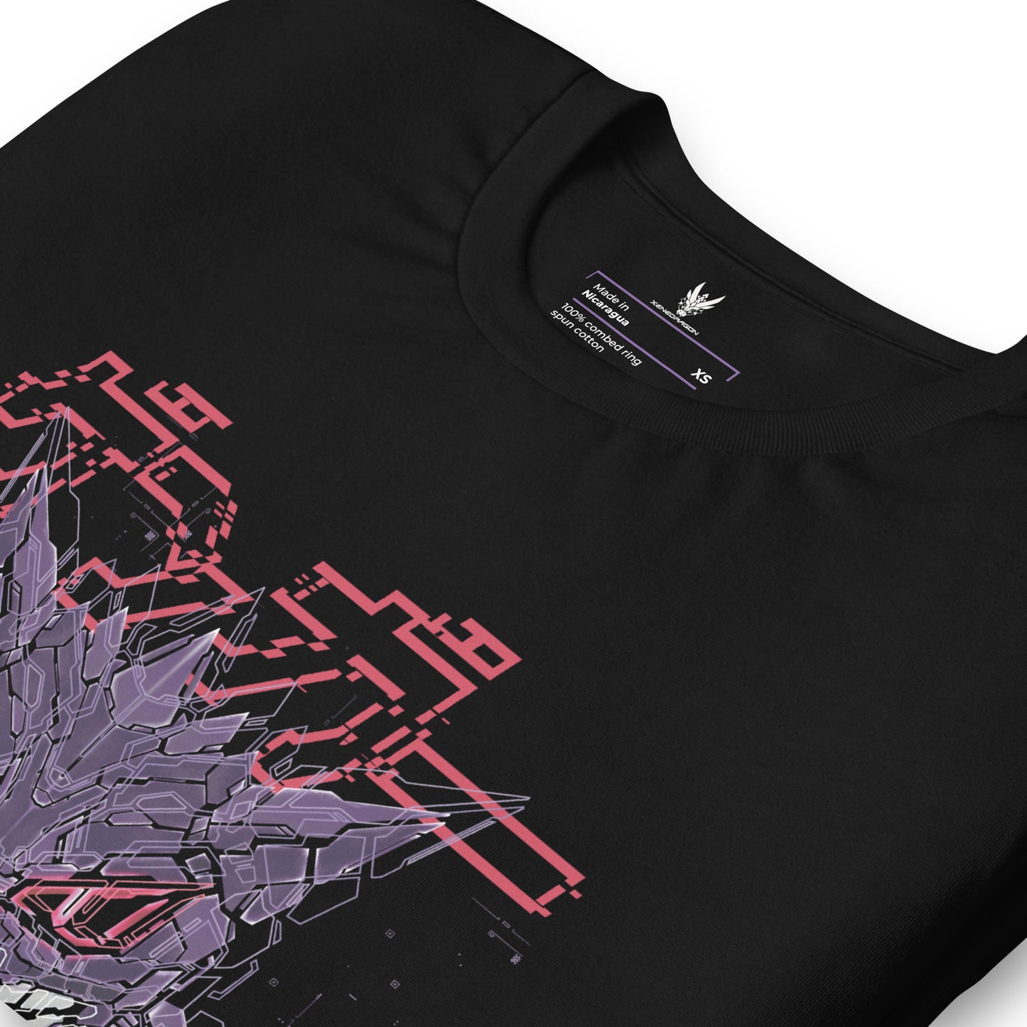 A close-up of the neck tag of a black t-shirt. The tag shows XeneDragon Logo, the size and other specifications of the shirt. The design is white text with purple accents.