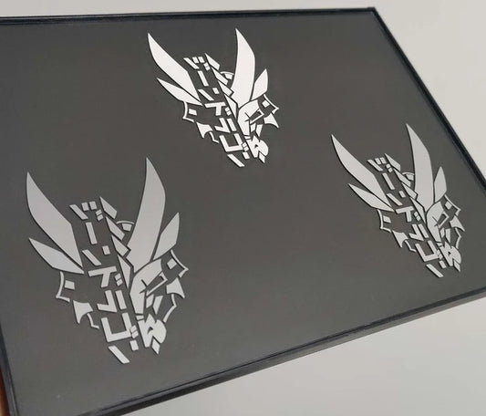 Three dragon decals in a picture frame featuring XeneDragon's Generation 1.1 DRGN design.