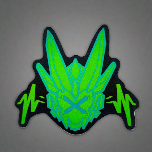 A sticker with a detailed design of a stylized dragon's head. The design features a dark background with a bright green, geometric shapes and two green, wavy lines below.