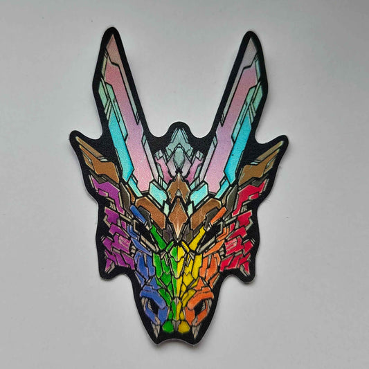 A special holographic sticker in XeneDragon's Generation Three DRGN design, the dragon head colors reflect the same colors as the progressive pride flag colors