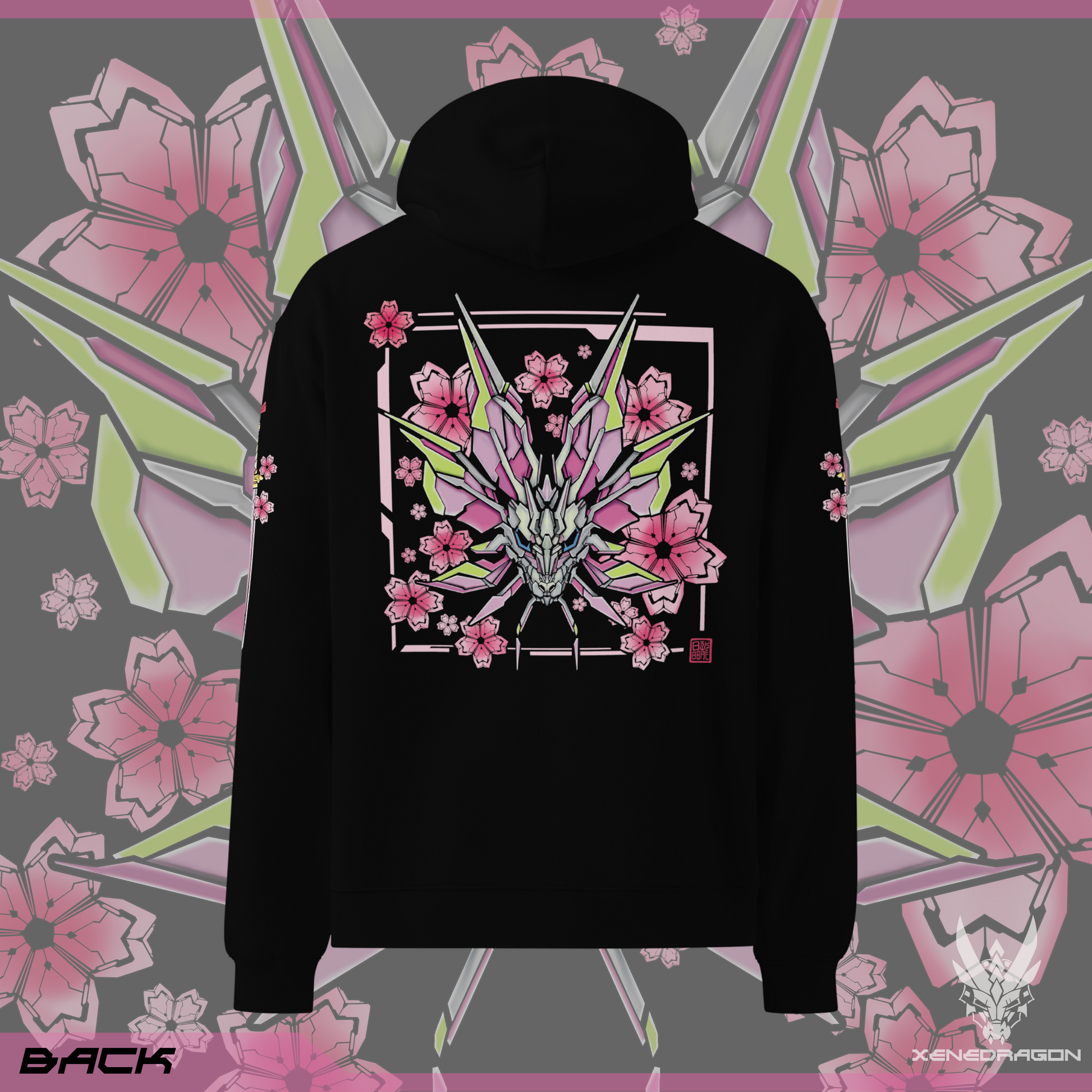 The back of the black hoodie shows a design of a stylized monster's head. The design features vibrant colors like pink, yellow, and blue. There are geometric japanese cherry blossoms within the background. Designed by XeneDragon