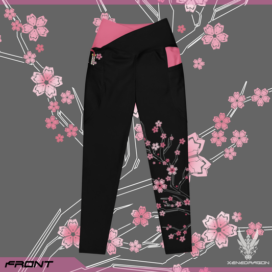 The front of the pair of black leggings with pink accents and geometric Japanese cherry blossom pattern design, There is a hidden sword design in the right pocket of the leggings.