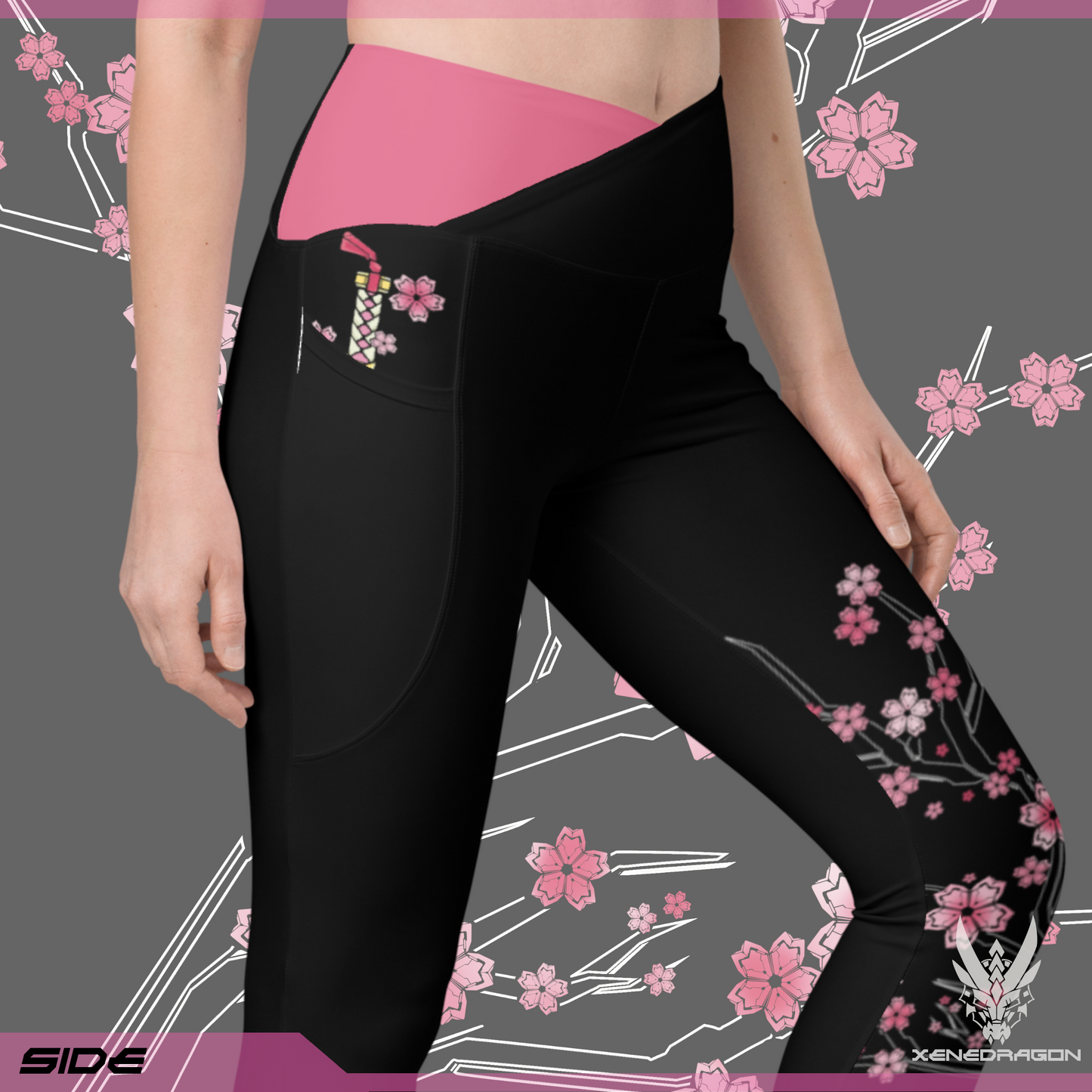 The side of the pair of black leggings with pink accents and geometric Japanese cherry blossom pattern design, There is a hidden sword design in the right pocket of the leggings.