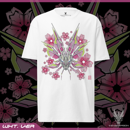 The front of the white shirt shows a design of a stylized monster's head. The design features vibrant colors like pink, yellow, and blue. There are geometric Japanese cherry blossoms within the background. Designed by XeneDragon