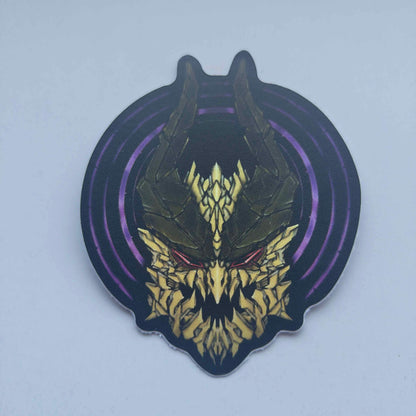 A special iridescent effect sticker with a detailed design of a stylized creature's head. The design features a dark background with a golden dragon head with a purple circular designs behind the dragon's head. Designed by XeneDragon.