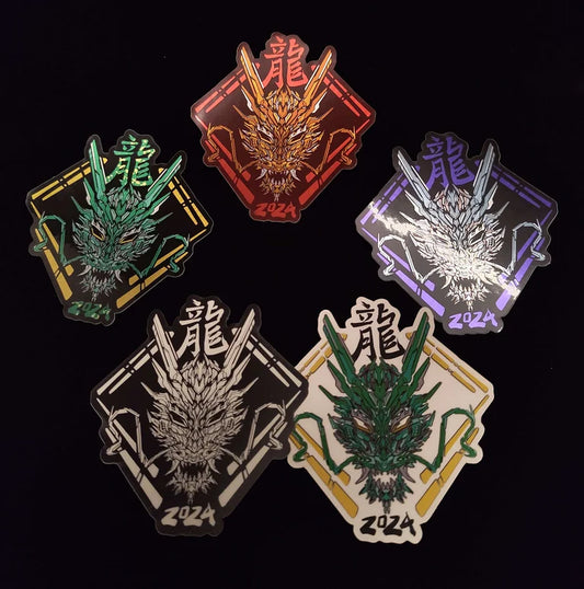 A collection of five stickers featuring a stylized dragon head design. The stickers are in different colors