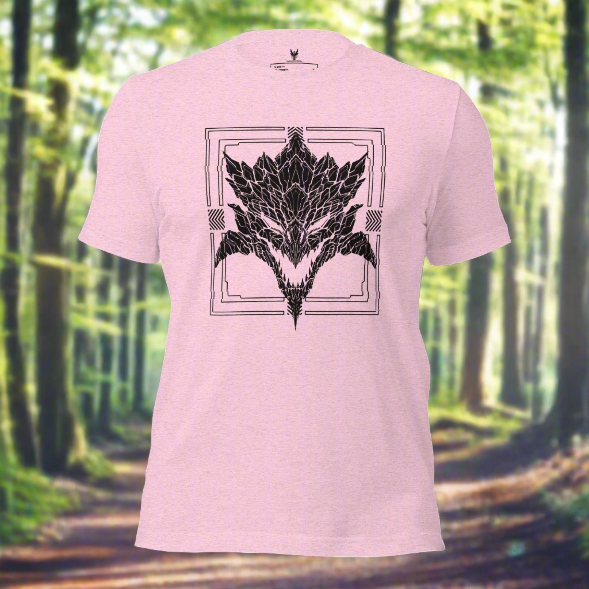 A pink shirt with a detailed black silhouette design of a stylized monster's head. Designed by XeneDragon.